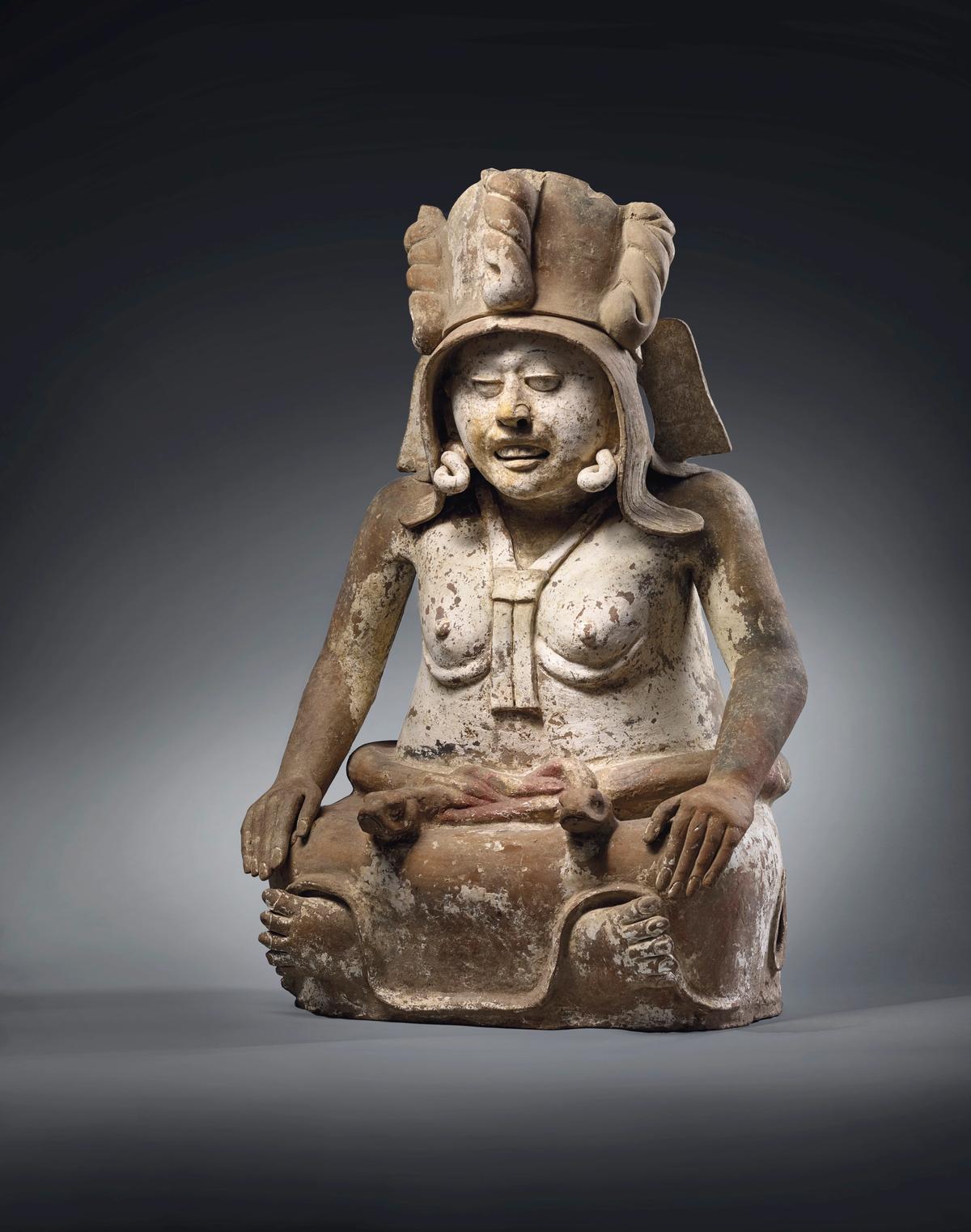 A Veracruz figure of Cihuateotl, a fertility goddess sitting with her legs crossed under her skirt, estimate €600,000-900,000 © Christie’s Images Ltd, 2021