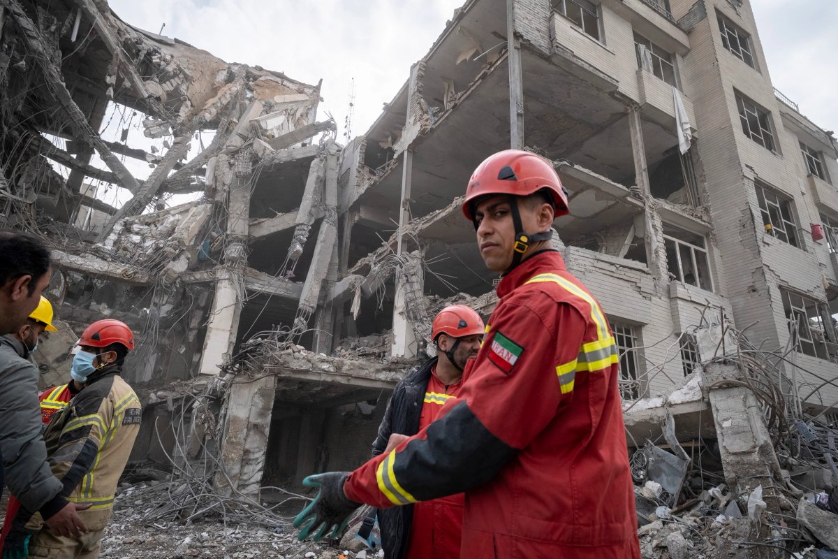 While firefighters deal with the impact of the US-Israeli military strikes in Tehran, Iran, the dealings of the ultrarich continue unimpeded Photo by Morteza Nikoubazl/NurPhoto via Getty Images