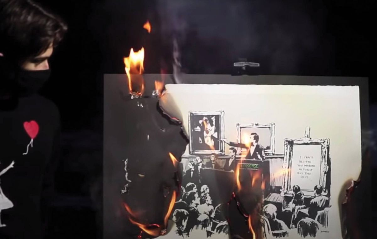 The live-streamed burning ceremony of Banksy’s Morons (2006) by the collective Burnt Banksy © Banksy. Photo: Burnt Banksy