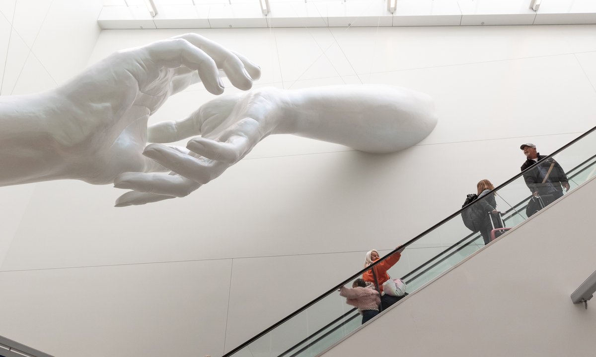 Hank Willis Thomas and Coby Kennedy reach for the skies with Chicago airport sculpture Hank Willis Thomas and Coby Kennedy reach for the skies with Chicago airport sculpture