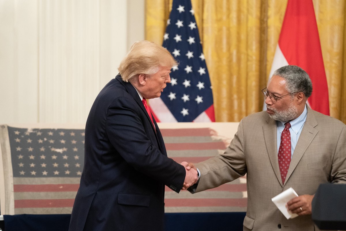 Smithsonian Institution Secretary Lonnie G. Bunch III (right) and US President Donald Trump shake hands during a ceremony at the White House in 2019
Official White House Photo by Shealah Craighead
