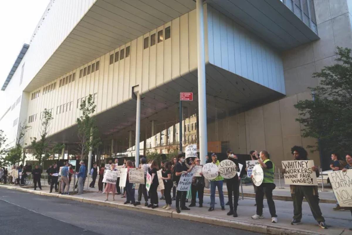 Members of the Whitney Museum Union protest outside the museum before ratifying their first contract after 16 months of negotiations Photo by Allison Dinner