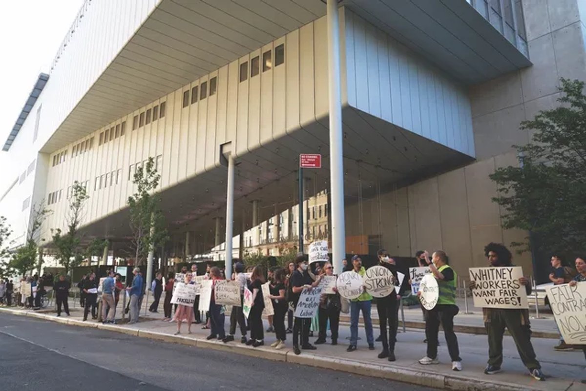 Members of the Whitney Museum Union protest outside the museum before ratifying their first contract after 16 months of negotiations Photo by Allison Dinner
