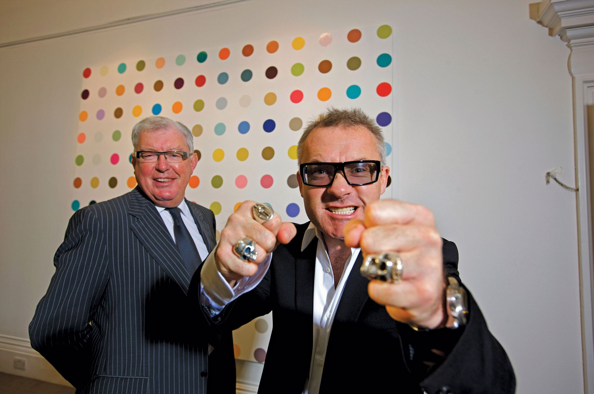 Damien Hirst with his then business manager, Frank Dunphy, before the Beautiful Inside My Head Forever auction in 2008 Martin Beddall/Alamy