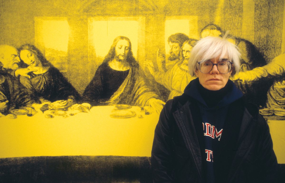 Andy Warhol in front of a version of The Last Supper, in Milan in 1987 Photo by Giorgio Lotti/Archivio Giorgio Lotti/Mondadori Portfolio via Getty Images