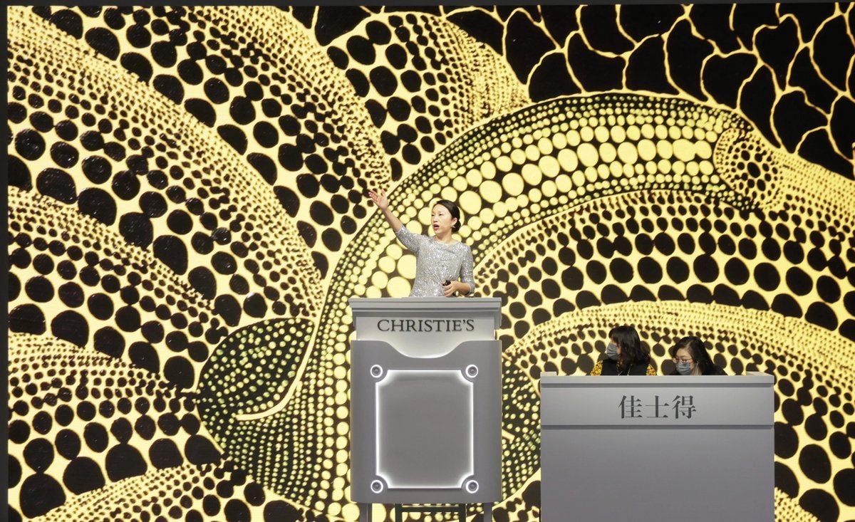 Christie's auctioneer Elaine Kwok selling a record-setting Pumpkin by Yayoi Kusama for $495m in Hong Kong earlier this year
Courtesy of Christie's