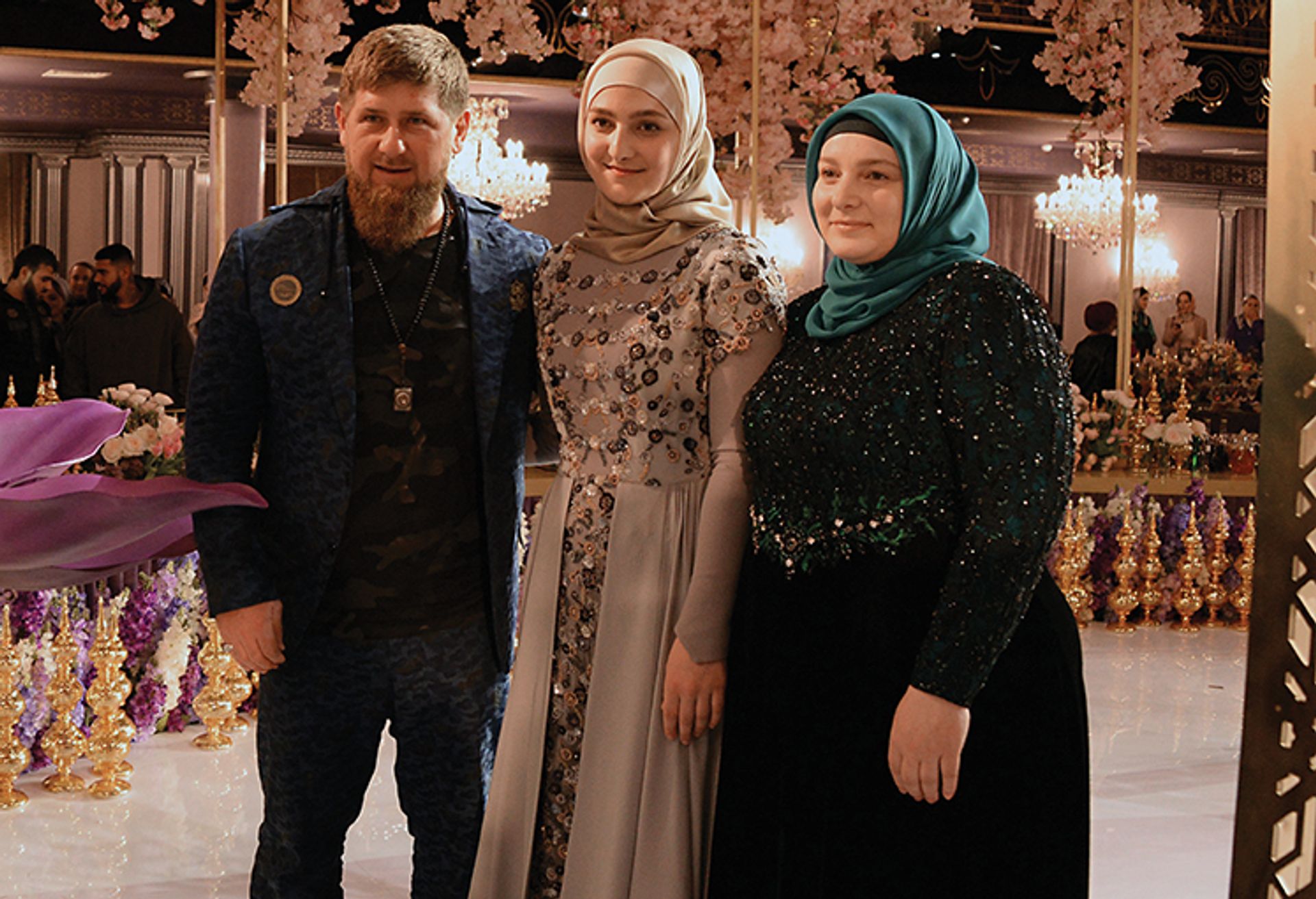 Aishat Kadyrova with her mother Medni Kadyrova, chief designer of the Firdaws Fashion House, and her father Chechnya's leader Ramzan Kadyrov © Said Tzarnaev / Sputnik