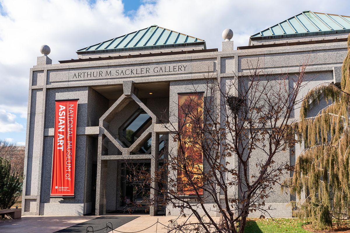The Arthur M. Sackler Gallery with its new banner identifying it as part of a National Museum of Asian Art Freer and Sackler staff