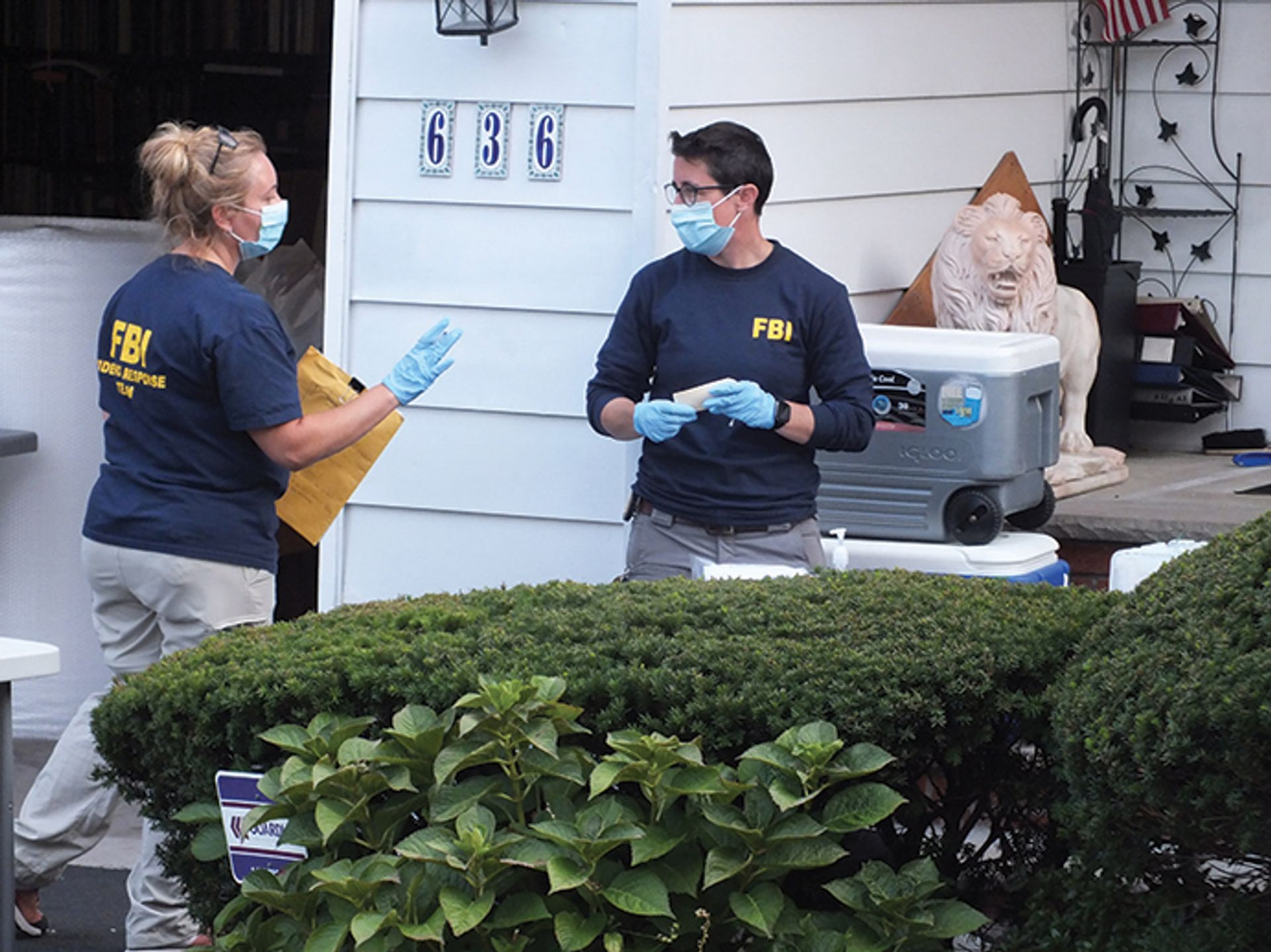 FBI agents gather evidence in the case against two dealers charged with fraud Boyd A. Loving