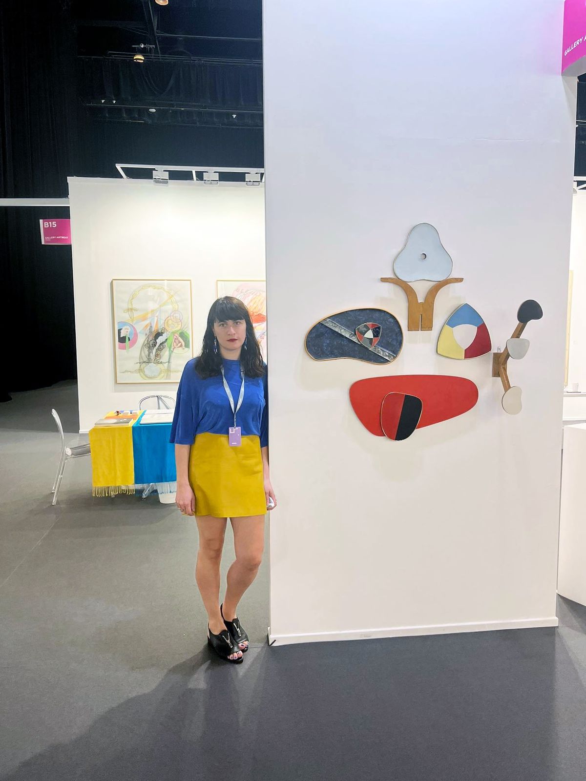 Natia Bukia, a co-founder of Gallery Artbeat, based in Tbilisi, Georgia, covered the booth table in a Ukrainian flag and wore Ukrainian colours for the VIP preview of Art Dubai Courtesy of Gallery Artbeat