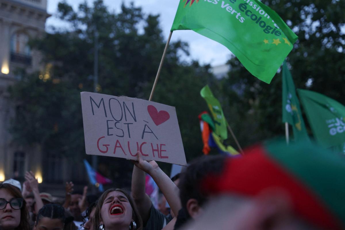 A demonstrator holding a placard with the message, my heart is on the left, at a rally in Paris Photo: Christophe Michel/Abacapress.com 