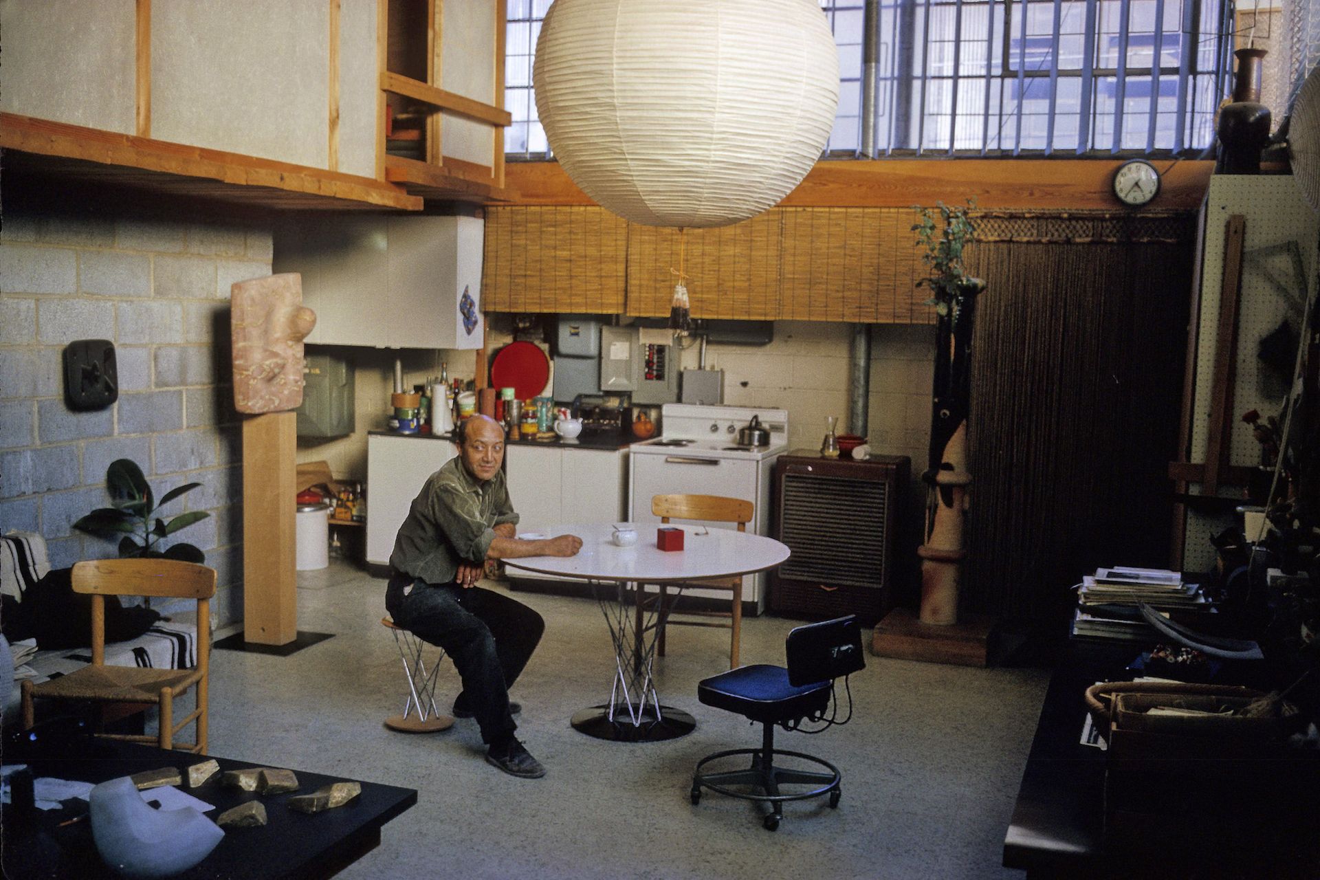 Isamu Noguchi in his 10th Street, Long Island City, Queens Studio, 1964. The Noguchi Museum Archives, 07282. Photo: Dan Budnik. ©The Isamu Noguchi Foundation and Garden Museum / ARS / Estate of Dan Budnik.
