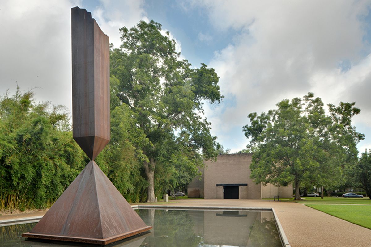 Broken Obelisk (1969) by Barnett Newman in the reflecting pool on the grounds of Rothko Chapel in Houston, Texas Wikimedia Commons