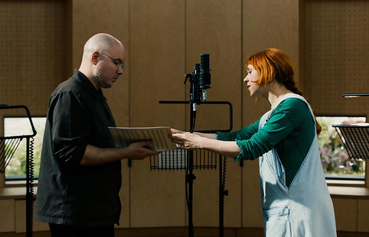 Preparing for The Call: Holly Herndon and Mat Dryhurst conducting a recording session with London Contemporary Voices in London, 2024 Courtesy: Foreign Body Productions