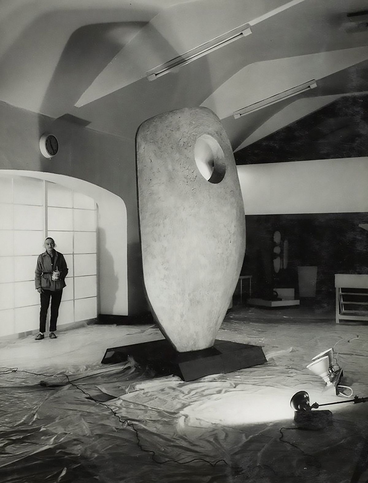 Hepworth in the Palais de Danse in 1962 with the plaster prototype for Single Form, which is installed outside the United Nations building in New York
Photo: Studio St Ives, © Bowness