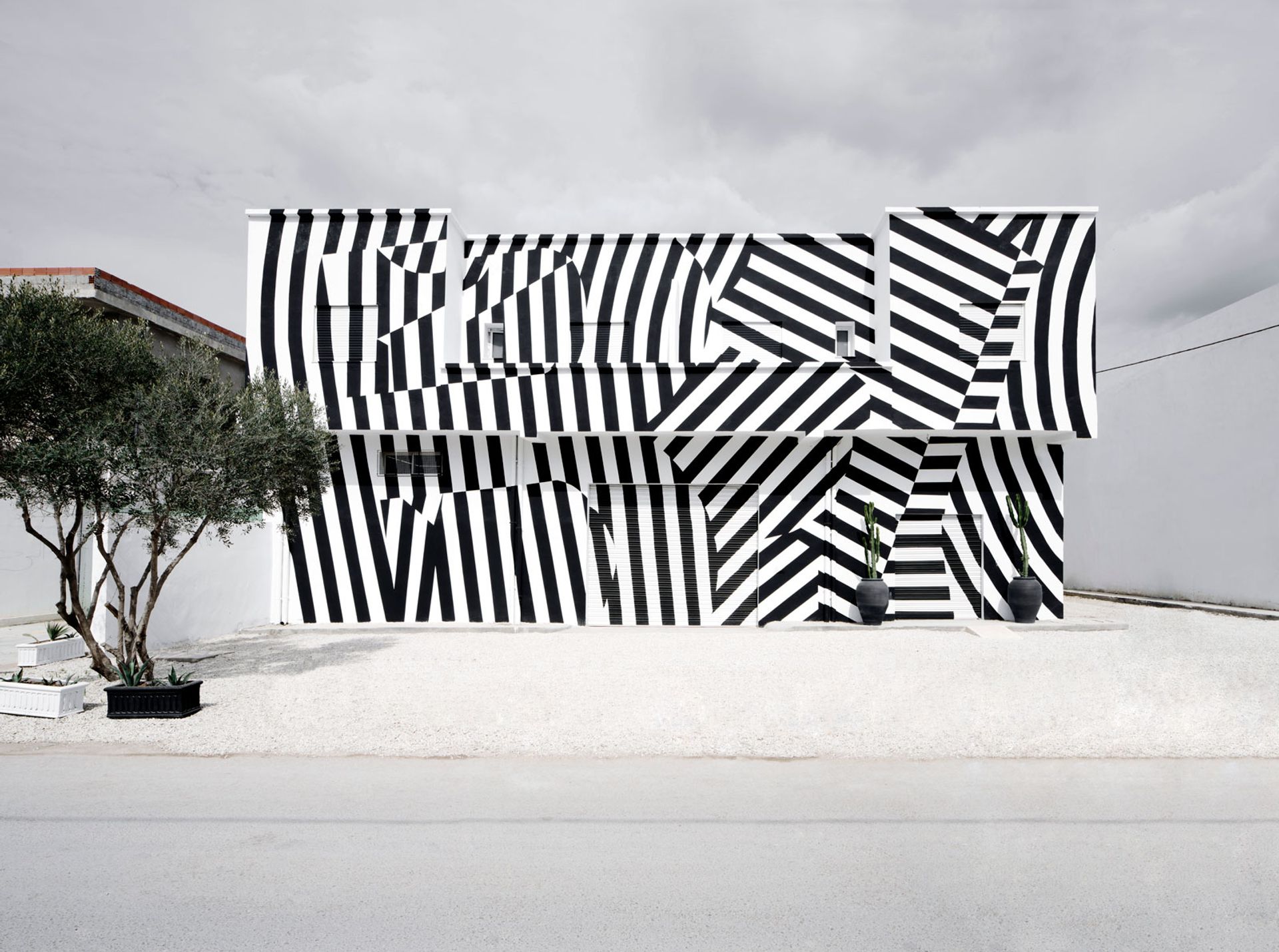 B7L9’s black-and-white striped exterior was painted with the help of local residents Photo: © yoann cimier