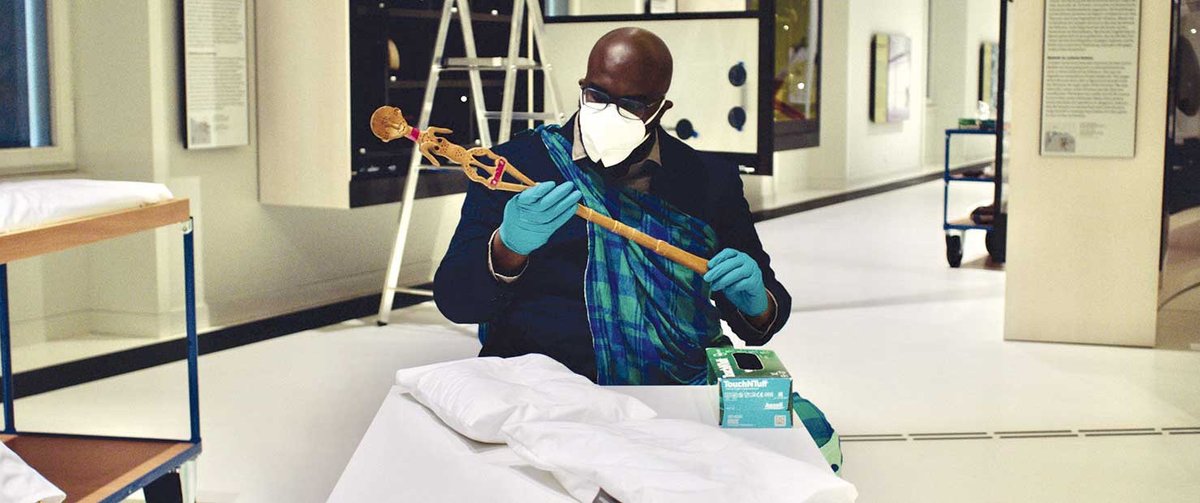 An Indigenous expert examines a carved walking stick looted from Suriname around 1900
Jongsma + O’Neill