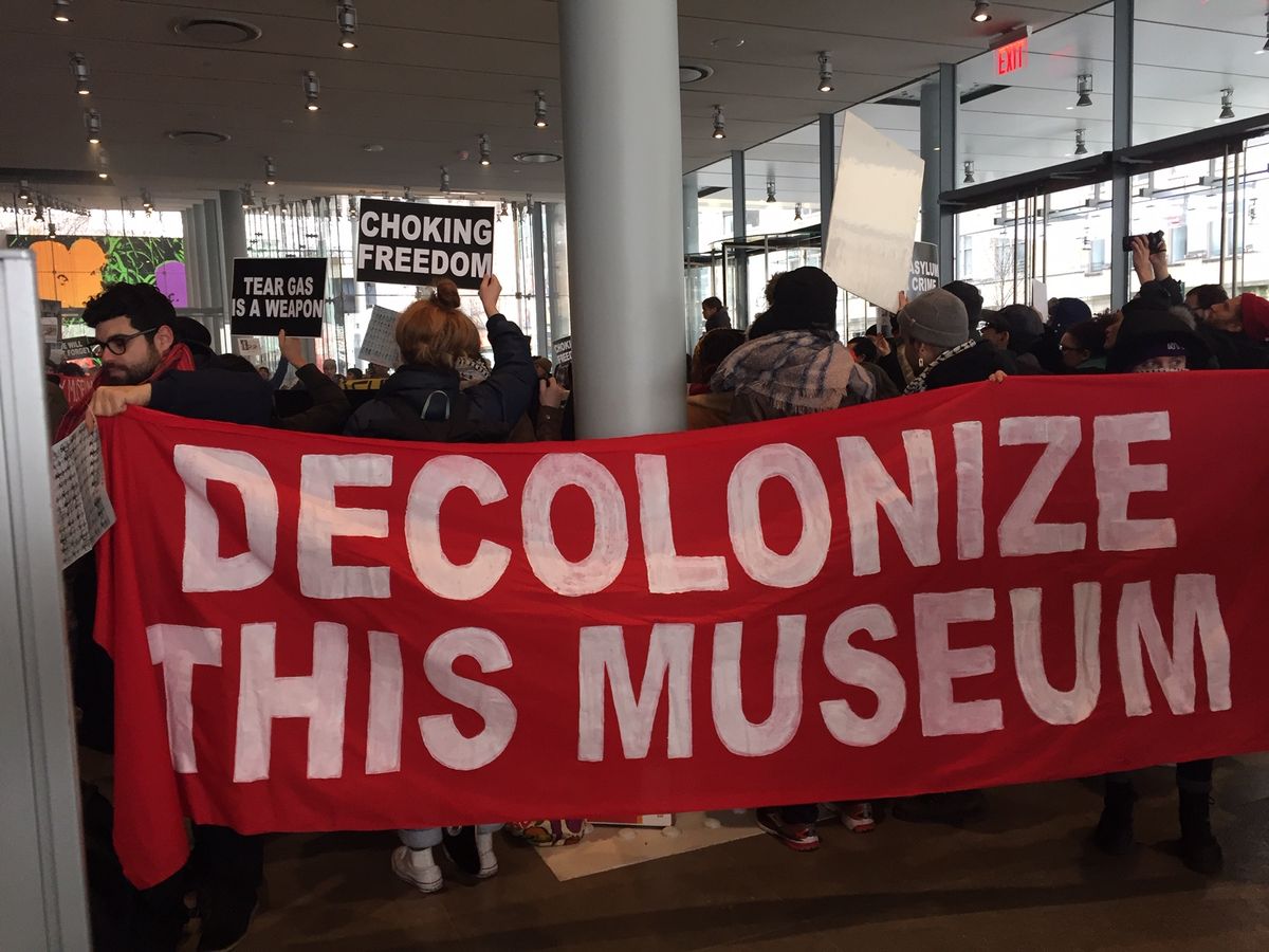 Protesters in the lobby of the Whitney Museum of American Art