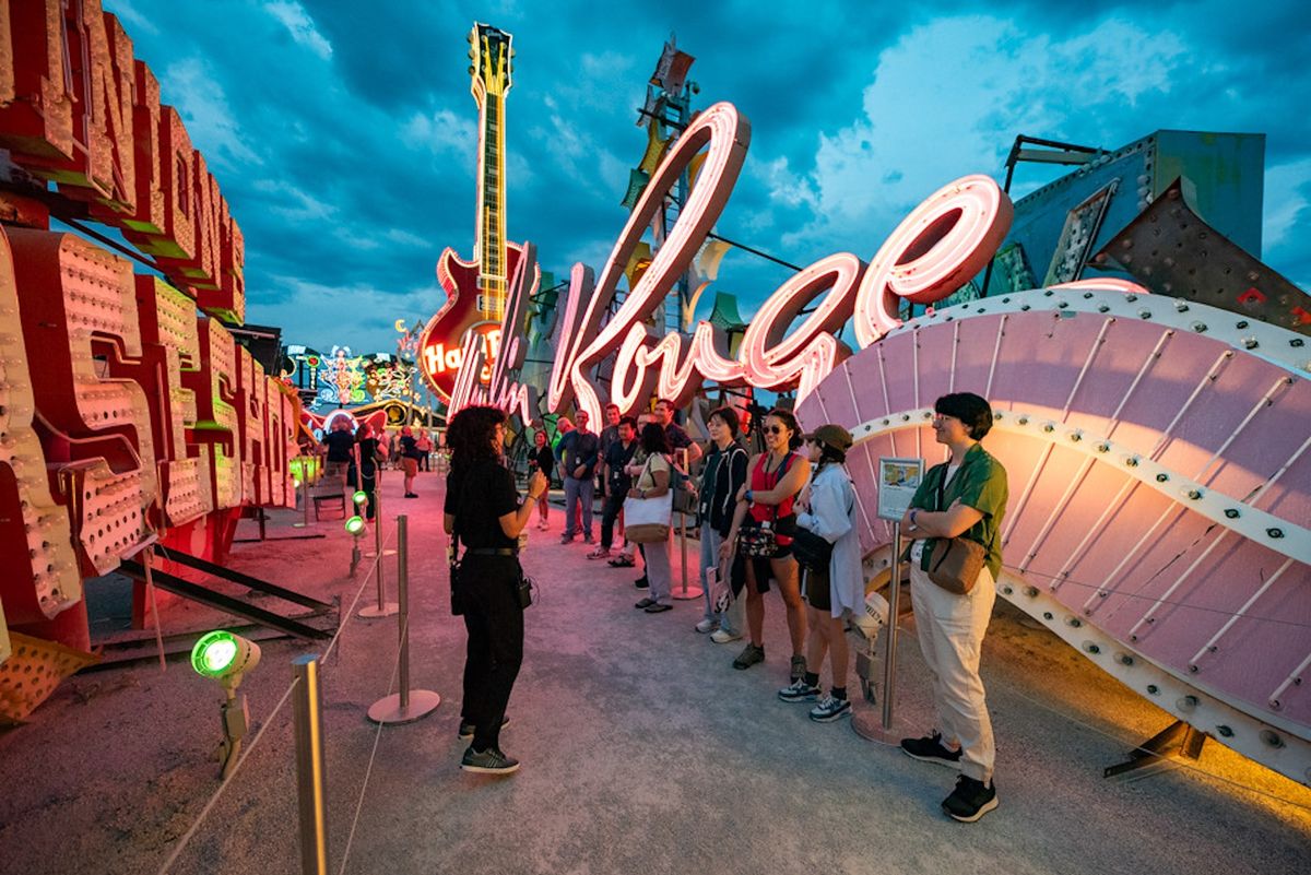 Visitors tour the Neon Museum's outdoor display of salvaged neon signage from Las Vegas hotels and casinos Courtesy of The Neon Museum, Las Vegas