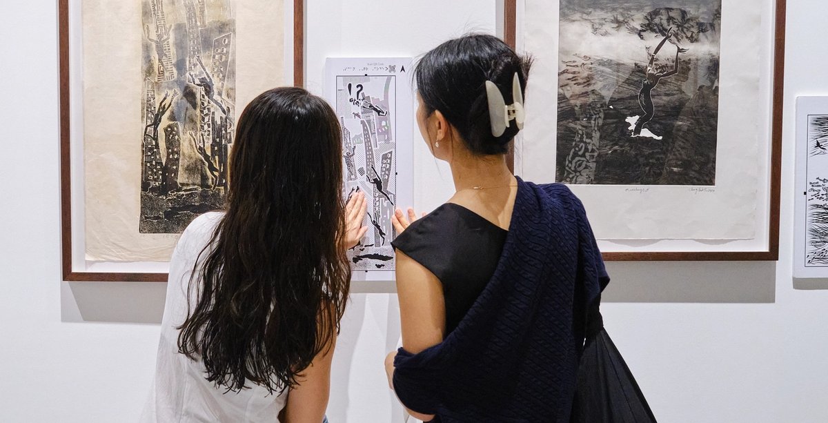 Visitors to the S.E.A. Focus art fair in 2025 interact with a tactile artwork created by Beyond Vision International for visually impaired visitors, based on Chng Seok Tin’s print. Chng Seok Tin had impaired vision following a car crash Courtesy S.E.A. Focus