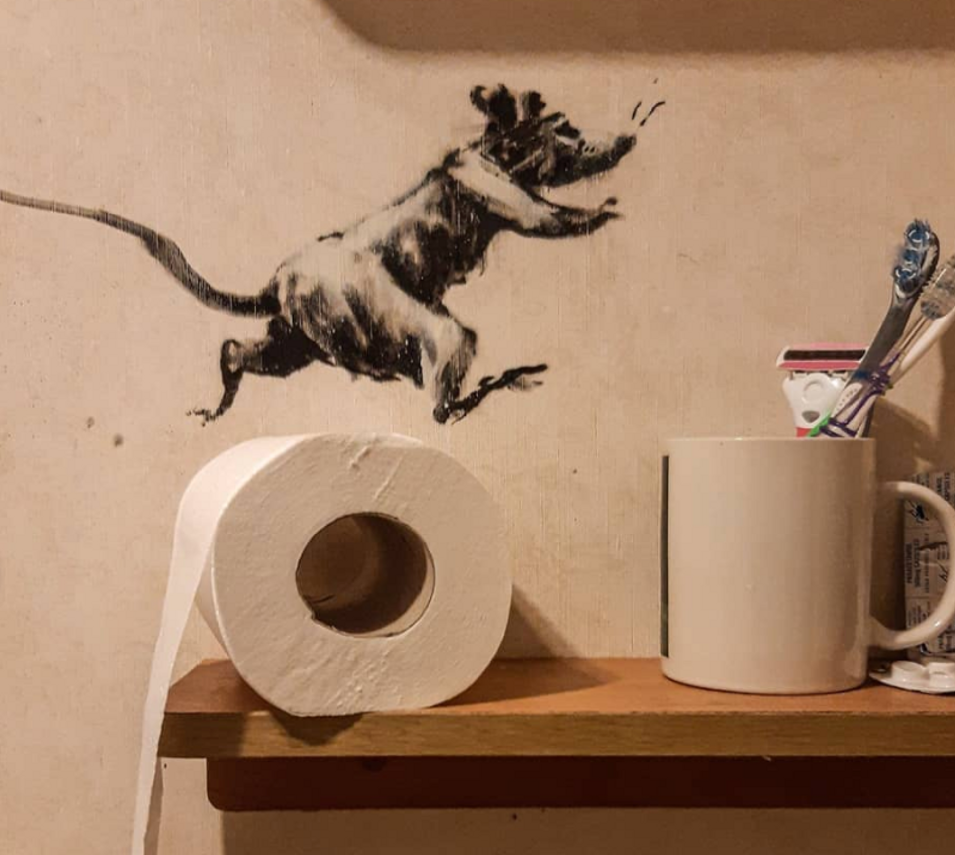 Banksy's iconic rat wastes precious loo roll. Banksy/ Instagram