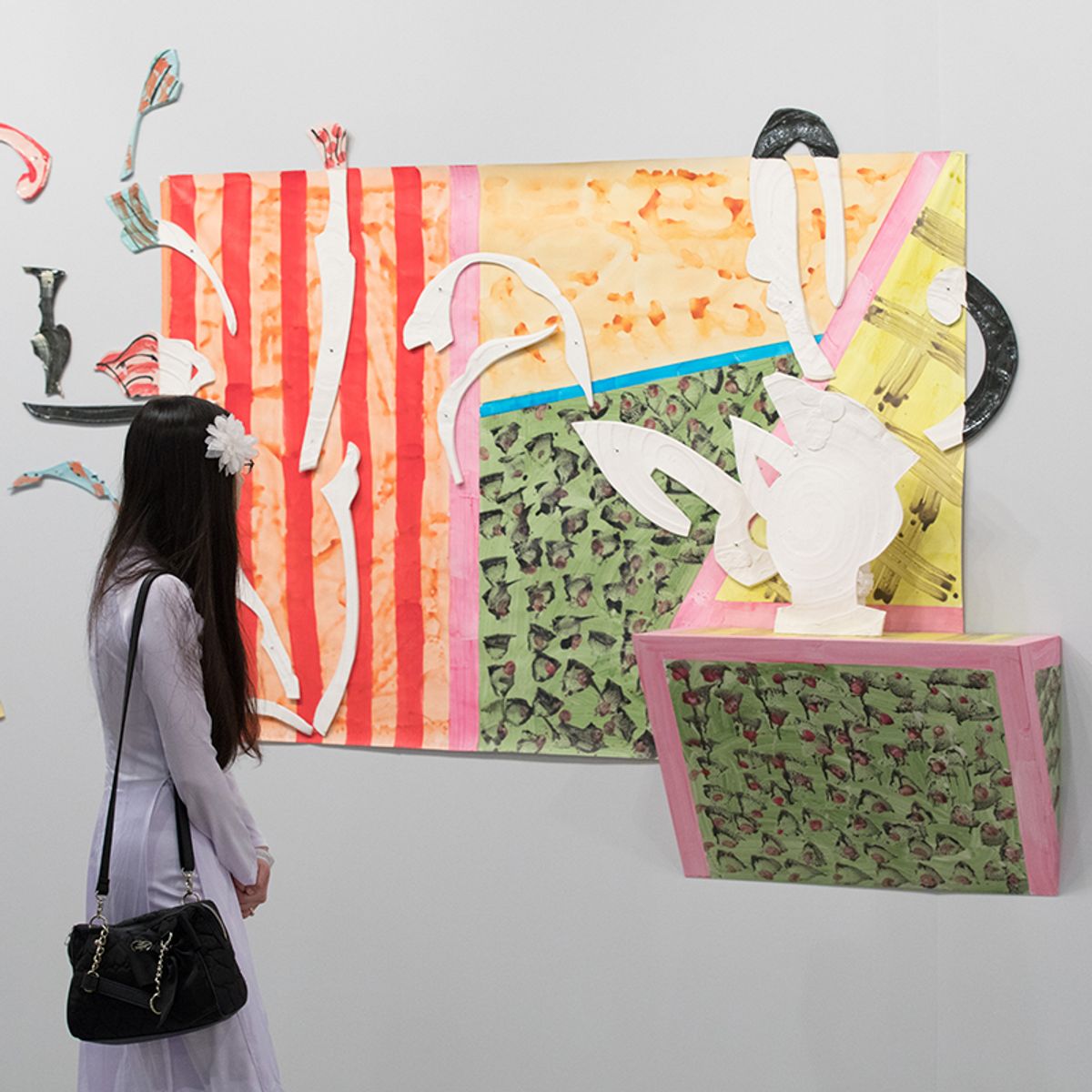 A visitor studies works by Betty Woodman on David Kordansky's stand at Art Los Angeles Contemporary Michael Underwood, Courtesy of Art Los Angeles Contemporary