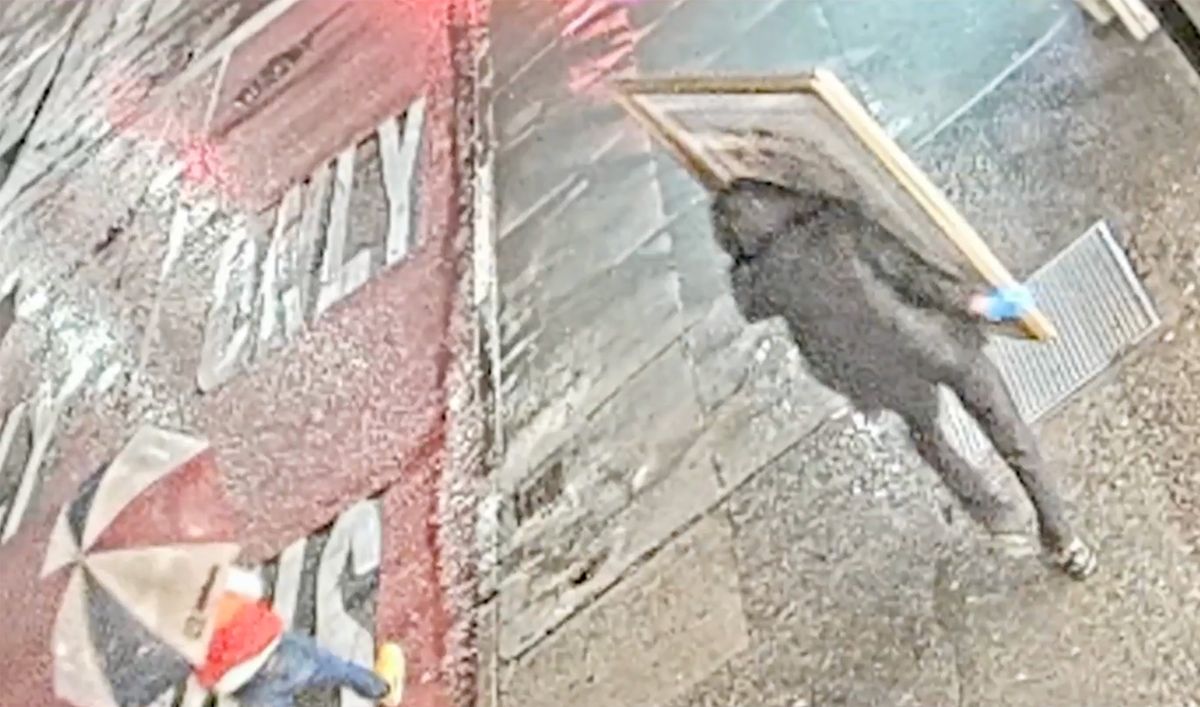 Thieves fleeing the Carlton Fine Arts gallery in Manhattan with a Marc Chagall print Security footage screenshot via NBC New York