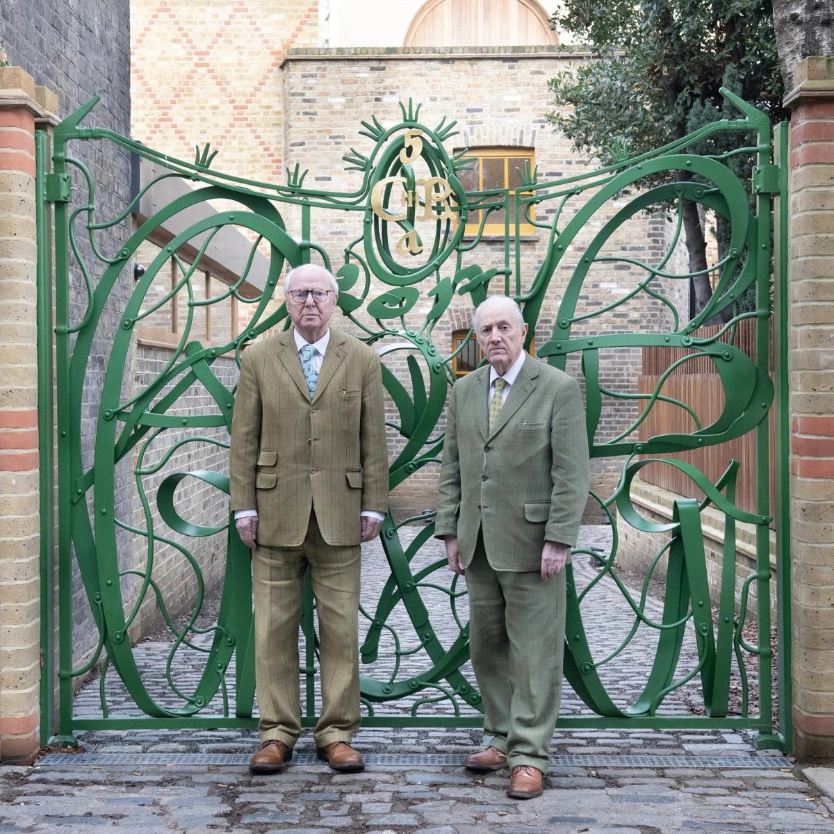 Gilbert Prousch and George Passmore in front of the gates of the Gilbert & George Centre © The Gilbert & George Centre