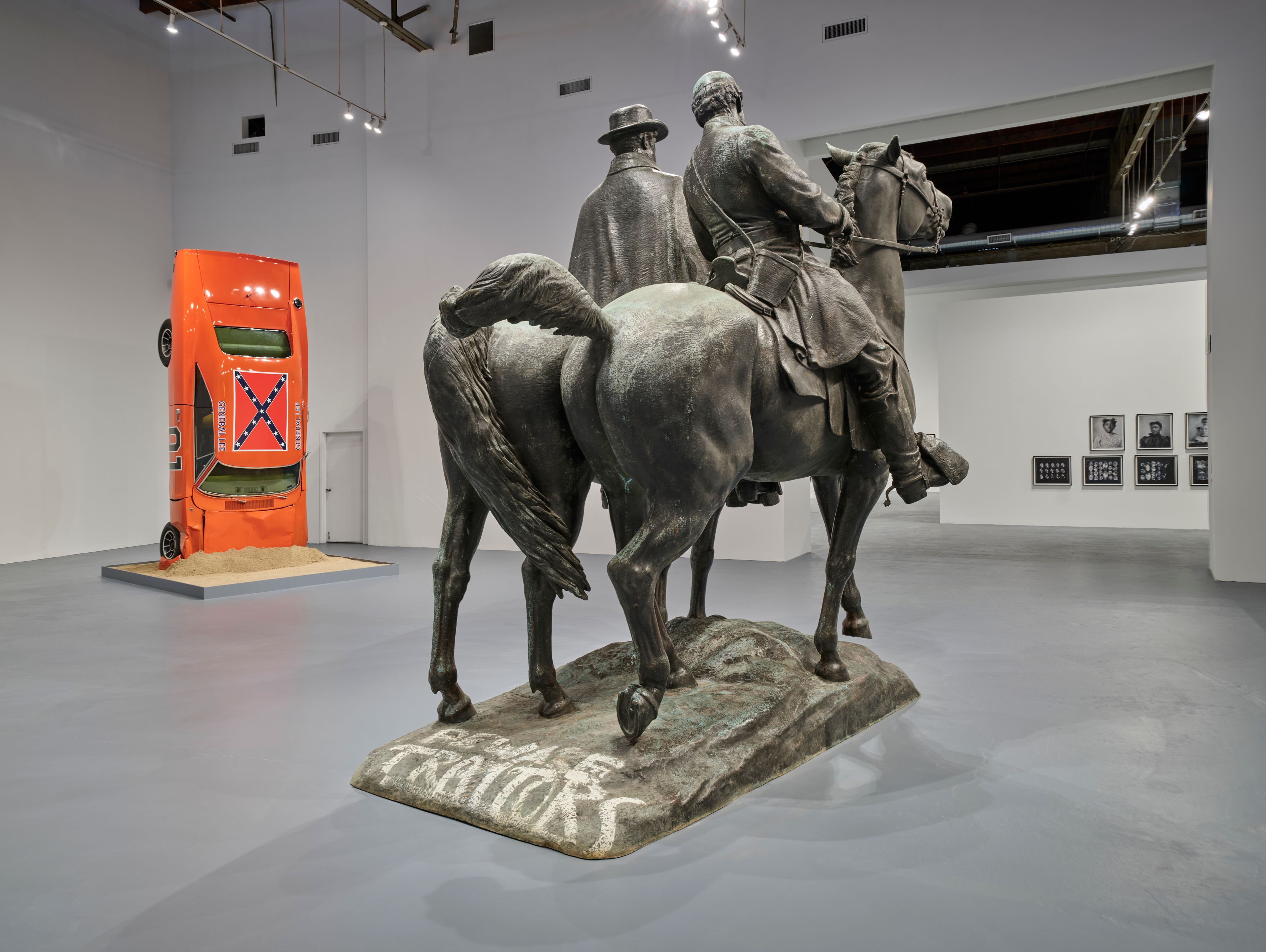 The exhibition places Hank Willis Thomas’s A Suspension of Hostilities (2019) alongside Laura Gardin Fraser’s now graffitied 1948 sculpture of Robert E. Lee and Stonewall Jackson Photo: Fredrik Nilsen, courtesy of The Museum of Contemporary Art (MOCA) and The Brick