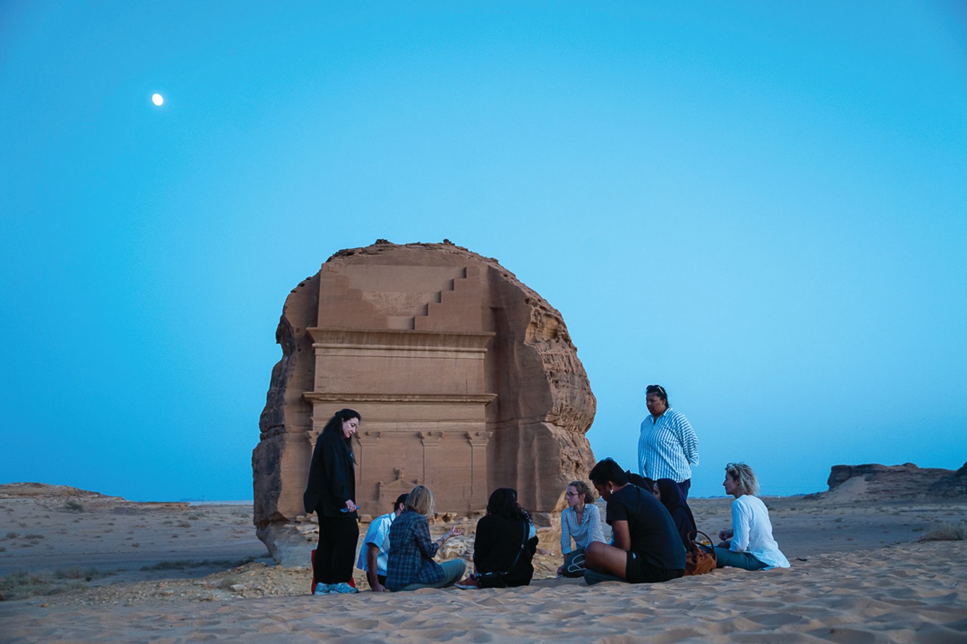 A group of artists at the archaeological site of Hegra in AlUla Courtesy of the artist Hegra; Courtesy of the Royal Commission for AlUla and Afalula