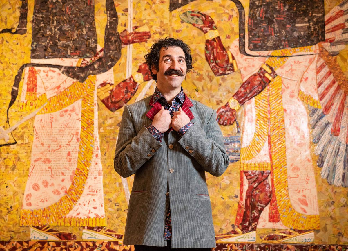 Michael Rakowitz in front of his work The invisible enemy should not exist (Northwest palace of Nimrud, Room N) (2018) © Photo John Nguyen/PA Wire; Courtesy Whitechapel Gallery