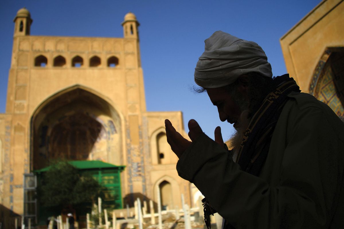 An Afghan man praying outside a mosque in Herat during Ramadan in 2018; there are fears that the devastating destruction of the country's cultural heritage 20 years ago could return Photo: Hoshang Hashimi/AFP via Getty Images