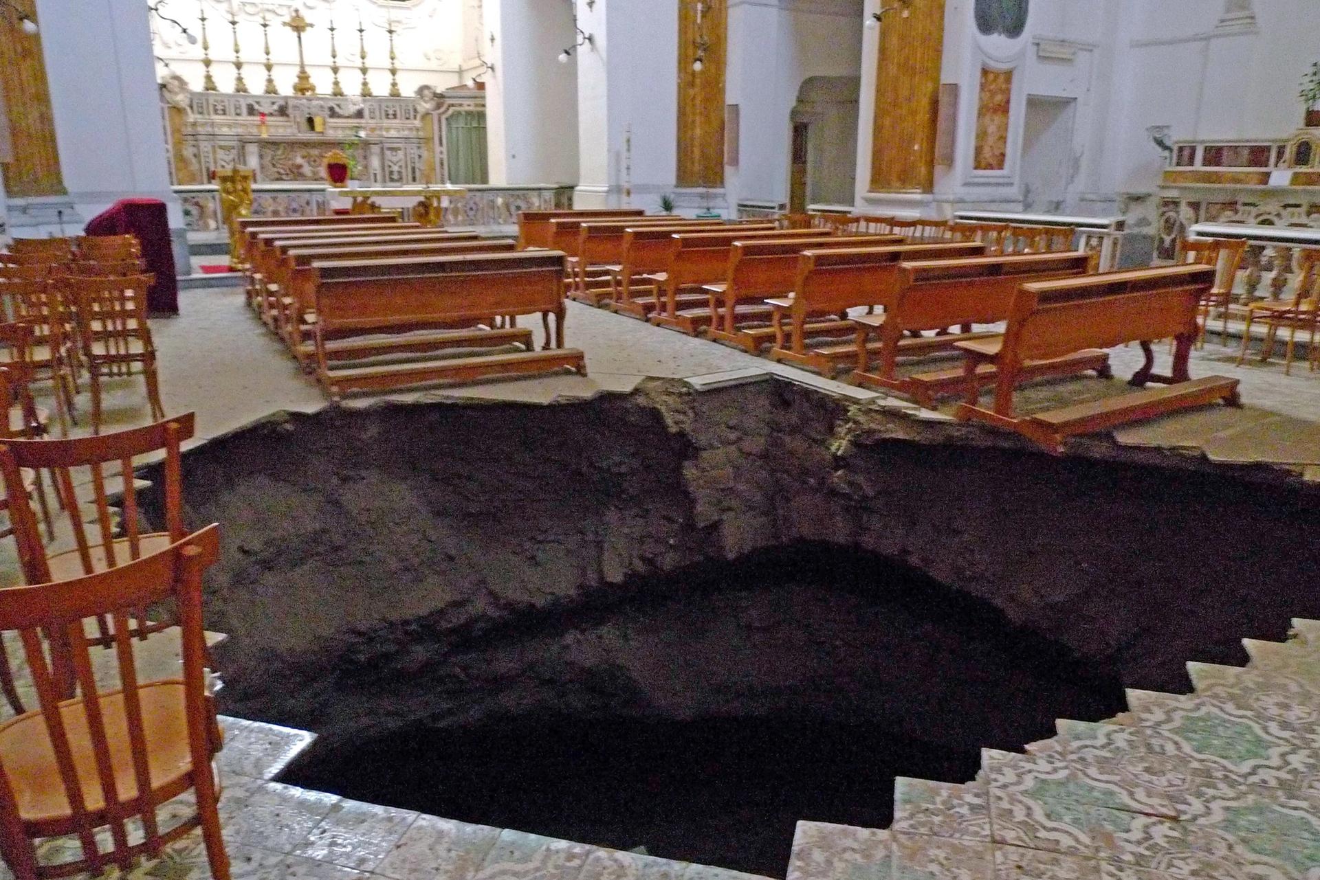 In September 2009, a sinkhole opened in the 17th century church of San Carlo alle Mortelle, known for its Baroque art, creating a pit more than five metres deep. The church reopened in 2017 after €1.5m worth of repairs Photo: Ciro Fusco/EPA/Shutterstock