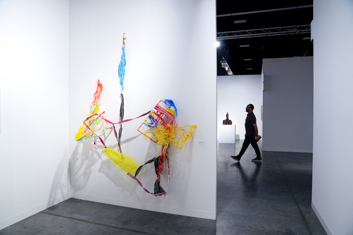 Julien Creuzet's Our secrets back to back, our secrets in our romances. Many torments, many dreams, many hallucinations, many fantasies before we fall asleep: meta and universe, tail of the dolphinfish (Coryphaena or Mahi-Mahi) drawn in the coat of arms of the Barbados islands, meta and universe, part of the ammonium nitrate molecule, fertilizer, meta and universe, leaves of Neurolaena lobata, «Herbe à pic» in the West Indies, known as a traditional treatment for wounds and infections, and used since 2020 against SarsCov2. Many torments, many dreams, many hallucinations, many fantasies before we fall asleep: meta and universe, sargassum baciferum, floating seaweed. Due to the increase in nitrates released by the Amazon, seaweed grow in large quantities in the Sargasso Sea and are then dropped off by the currents on the Caribbean beaches, meta and universe, part of 1956 american machine that produce ammonium nitrate, a fertilizer from the nitrogen in the air, meta and universe, head of one of the pink flamingo drawn in the coat of arms of the Turks and Caicos islands, meta and universe, last part of the ammonium nitrate formula (2022) in the Andrew Kreps stand at Art Basel in Miami Beach Eric Thayer