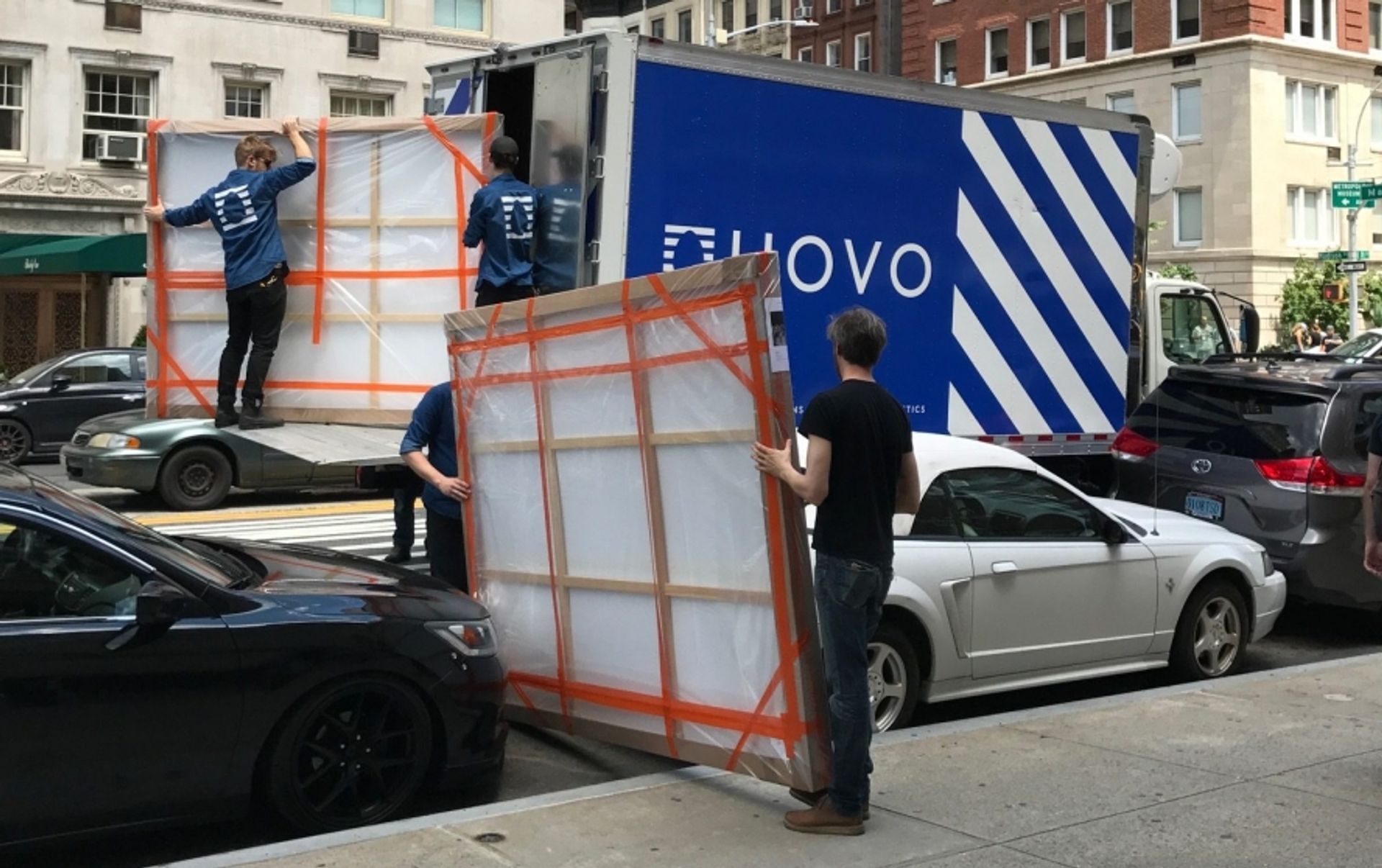 UOVO art handlers de-installing a gallery exhibition on Manhattan's Upper East Side. Courtesy of UOVO