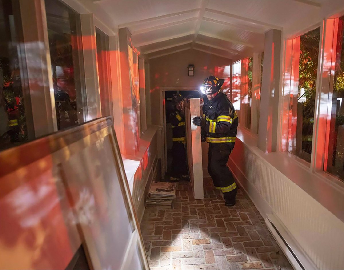 Firefighters evacuating artwork from Perelman's East Hampton estate, the Creeks, during a fire in 2018. New York State Supreme Court filing