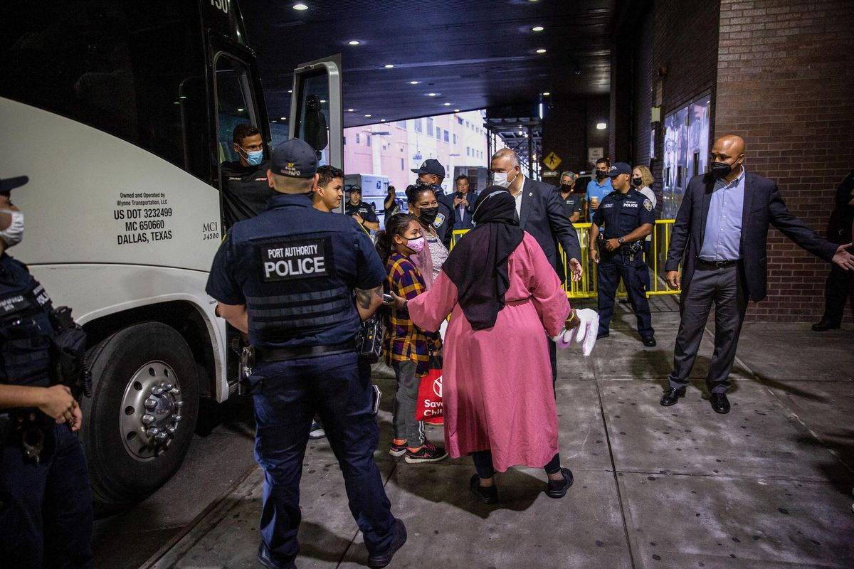A bus with 52 asylum seekers from Texas arrives at the Port Authority terminal in New York City. SOPA Images Limited / Alamy Stock Photo