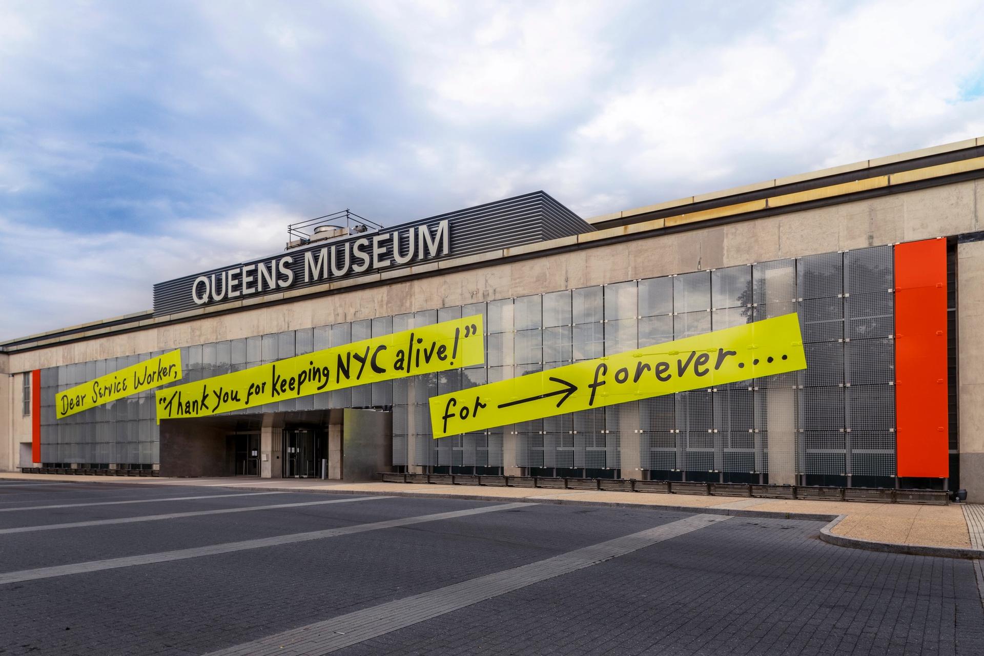 The Queens Museum facade facing Grand Central Parkway featuring Mierle Laderman Ukeles, For ⟶ Forever (2020). © Mierle Laderman Ukeles. Photo: Hai Zhang.