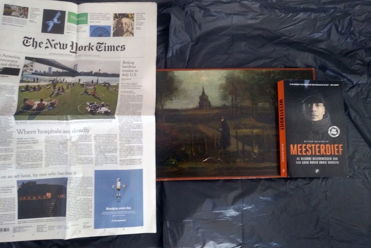 Van Gogh’s The Parsonage Garden at Nuenen in the Spring (1884) with a copy of the New York Times (30 May 2020) and Wilson Boldewijn’s book Meesterdief (2018) 