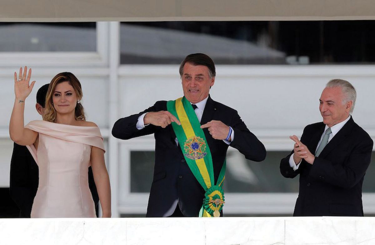 Jair Bolsonaro, seen here with his presidential sash at his inauguration, has  sparked buyer confidence through his proposals. © AP Photo/Silvia Izquierdo
