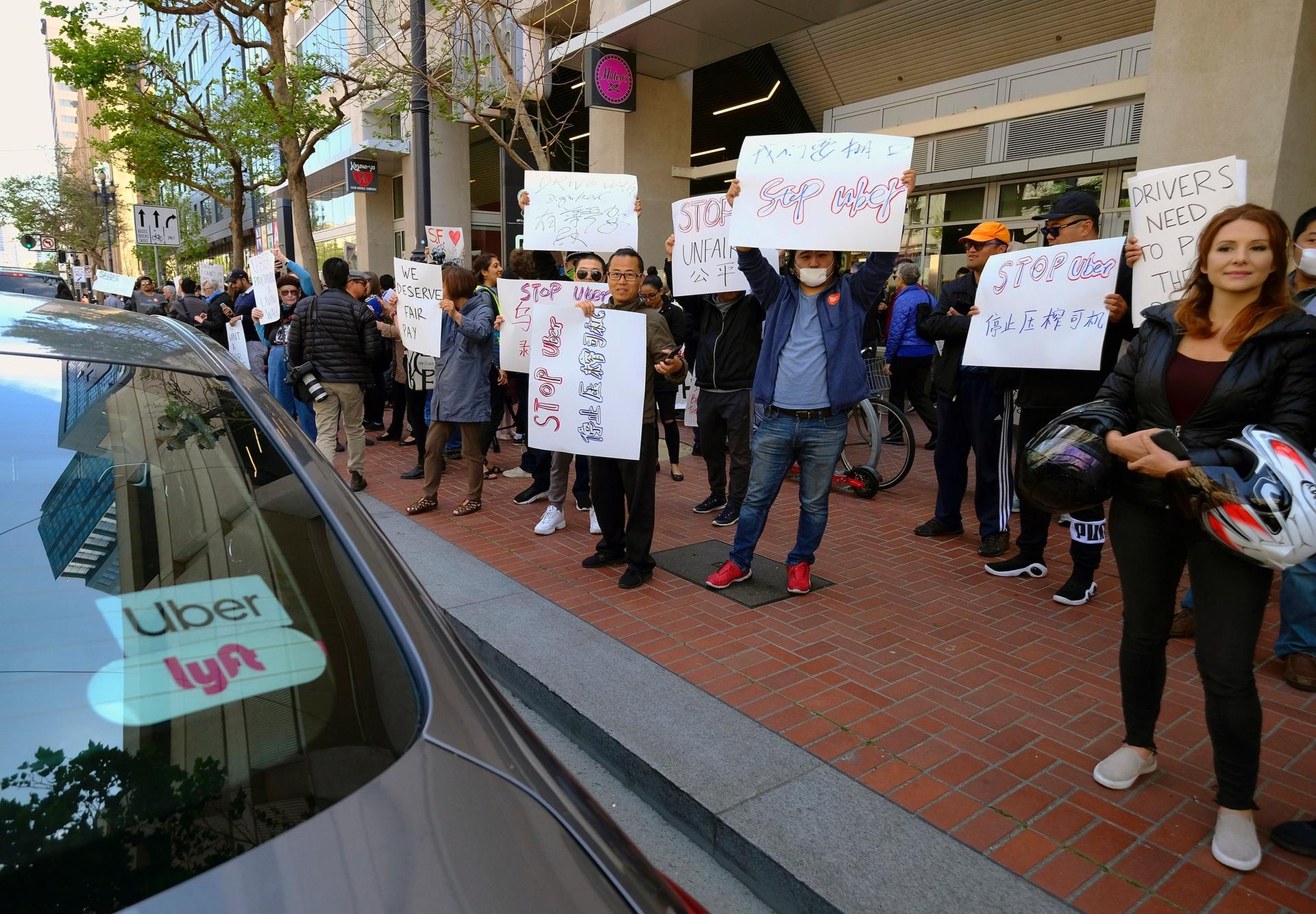 Uber and Lyft drivers protest over wages outside of Uber’s headquarters in San Francisco AP Photo/Eric Risberg, File