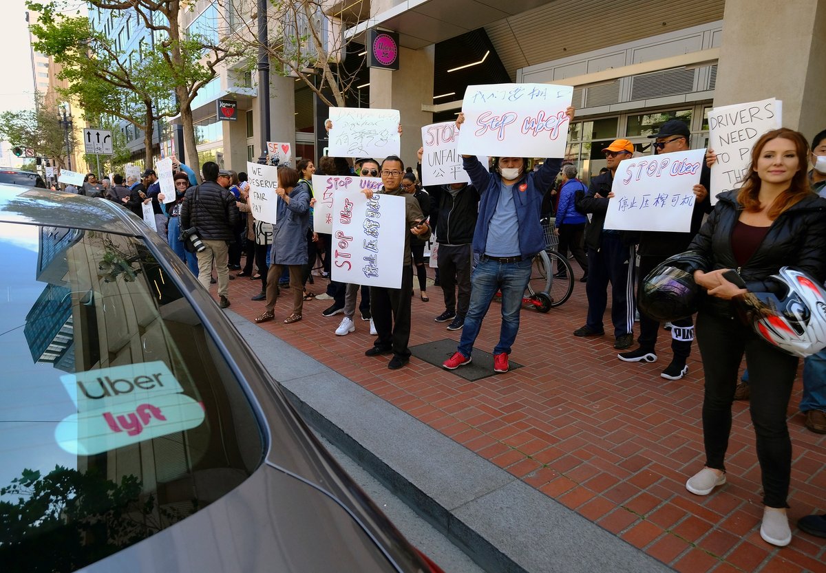Uber and Lyft drivers protest over wages outside of Uber’s headquarters in San Francisco AP Photo/Eric Risberg, File