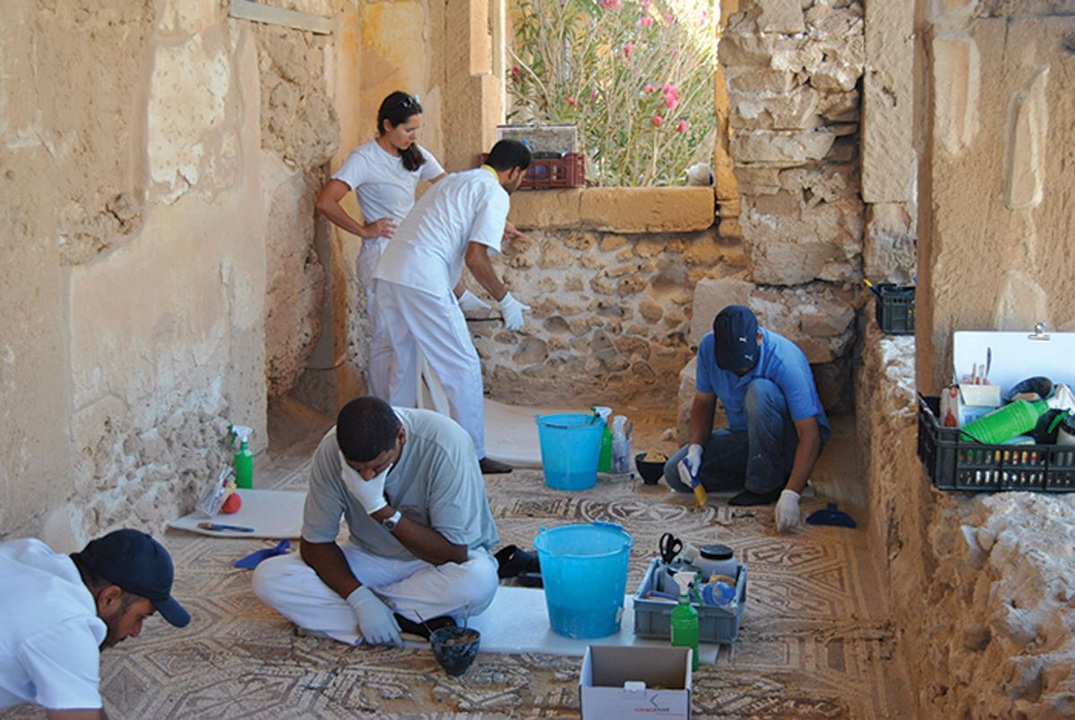 Italian and Libyan archaeologists work together at the Roman ruins of Leptis Magna, a Unesco-protected site