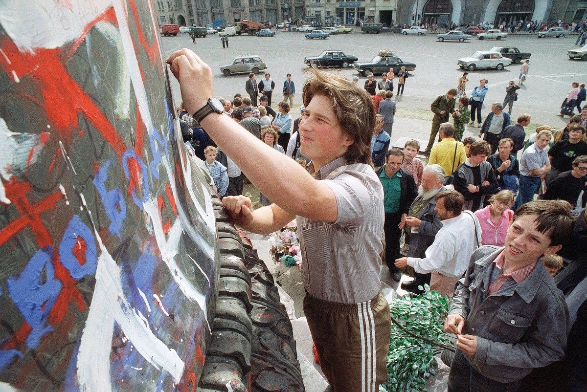 Muscovites writes anti-KGB slogans on the base of the statue of Felix Dzerzhinsky founder of KGB, in Moscow AP Photo/Czazek Sokolowski
