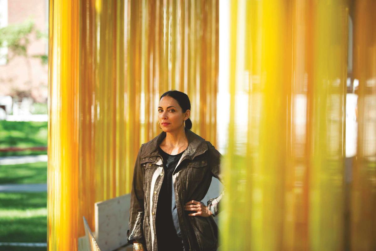Teresita Fernández, standing inside her luminous, public installation Autumn (... Nothing Personal) Stephanie Mitchell/Harvard Staff Photographer. © 2018 The President and Fellows of Harvard College