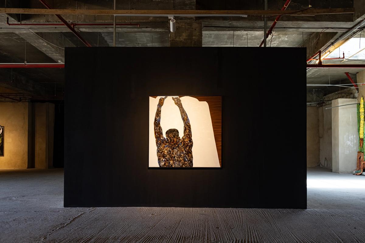 An installation view of Amoako Boafo's Seated Forward Fold (2023) on view in the exhibition In and out of Time at Gallery 1957 © Courtesy of Gallery 1957