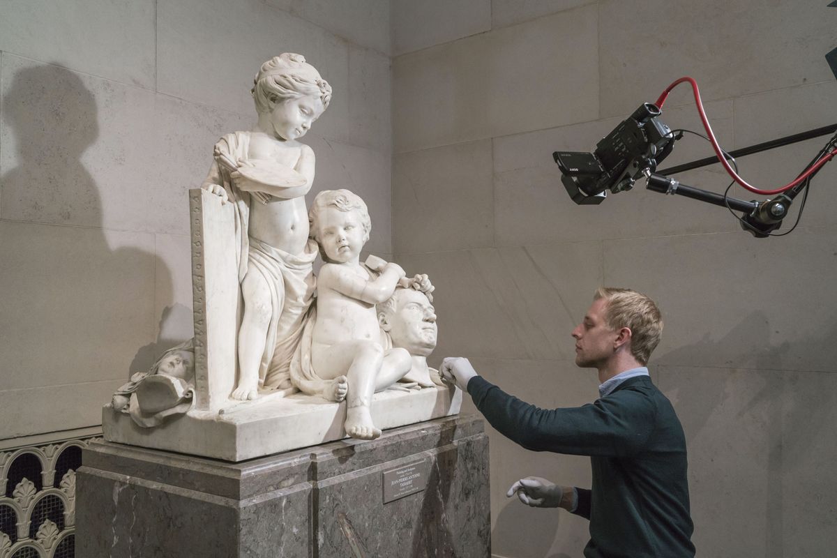 Robert Price, a conservator at the National Gallery of Art in Washington, DC, working on Jean-Pierre-Antoine Tassaert’s marble Painting and Sculpture (1774/1778) before the institution closed its doors © National Gallery of Art