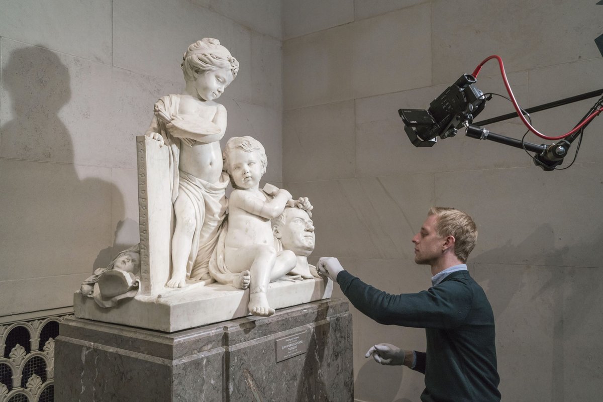 Robert Price, a conservator at the National Gallery of Art in Washington, DC, working on Jean-Pierre-Antoine Tassaert’s marble Painting and Sculpture (1774/1778) before the institution closed its doors © National Gallery of Art