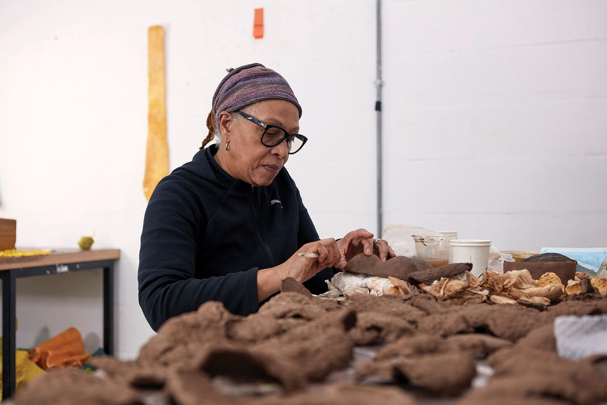 Ryan, at work at Spike Island, uses myriad materials, from bronze and clay to fruit skins and tea bags © Max McClure