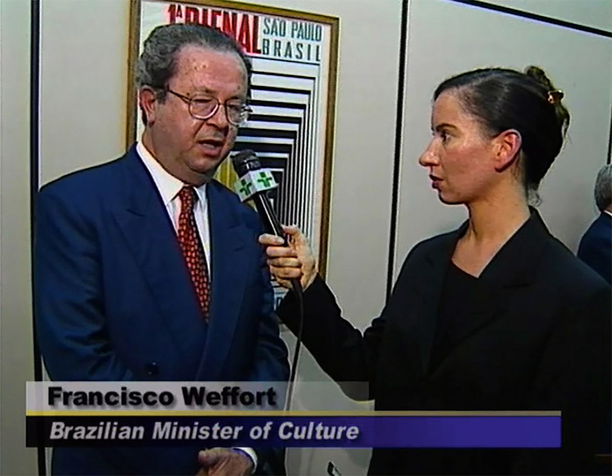 A still from Andrea Fraser’s Reporting from São Paulo; I am from the United States (1998) in which the artist posed as a reporter to explore issues such as neo-colonialism © the artist; courtesy of Marian Goodman Gallery